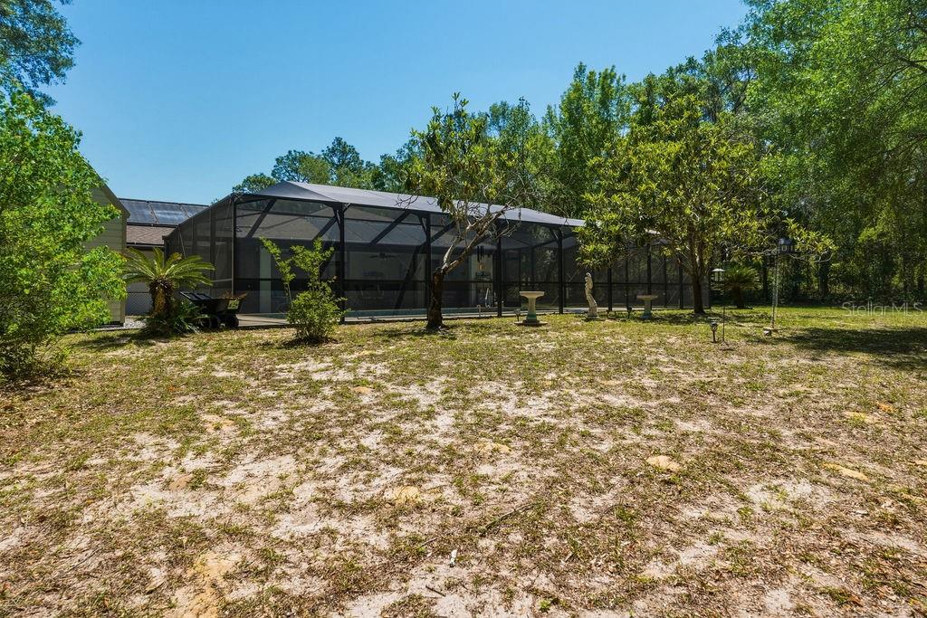 8873 Southwest 200th Circle Dunnellon, FL 34431 - Photo 41 of 61 a backyard of a house with lots of green space
