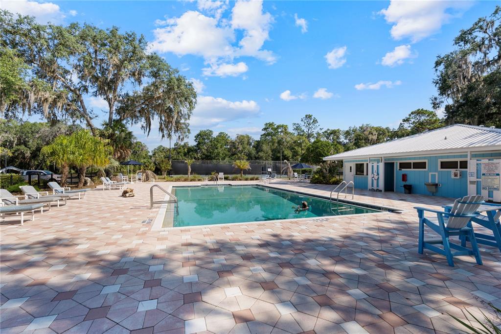 8873 Southwest 200th Circle Dunnellon, FL 34431 - Photo 49 of 61 a view of a house with swimming pool and sitting area