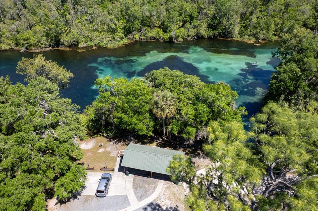 8873 Southwest 200th Circle Dunnellon, FL 34431 - Photo 58 of 61 an aerial view of a house with a yard and lake view