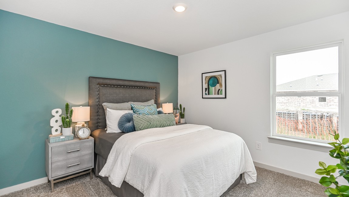 7918 Murciana Drive Rosharon, TX 77583 - Photo 6 of 21 a bedroom with a bed and a window