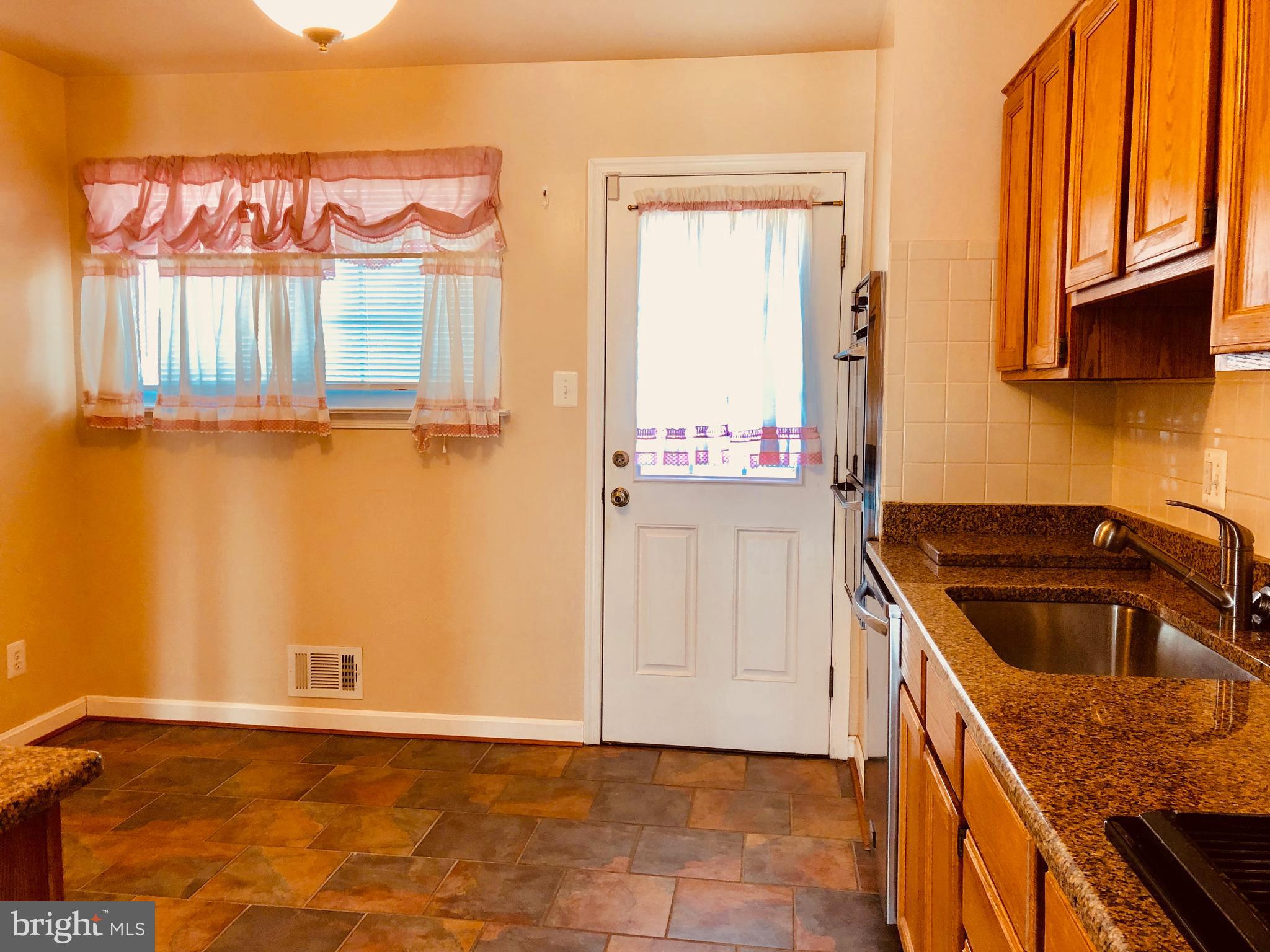1324 Gresham Road Silver Spring, MD 20904 - Photo 5 of 36 Kitchen door to deck