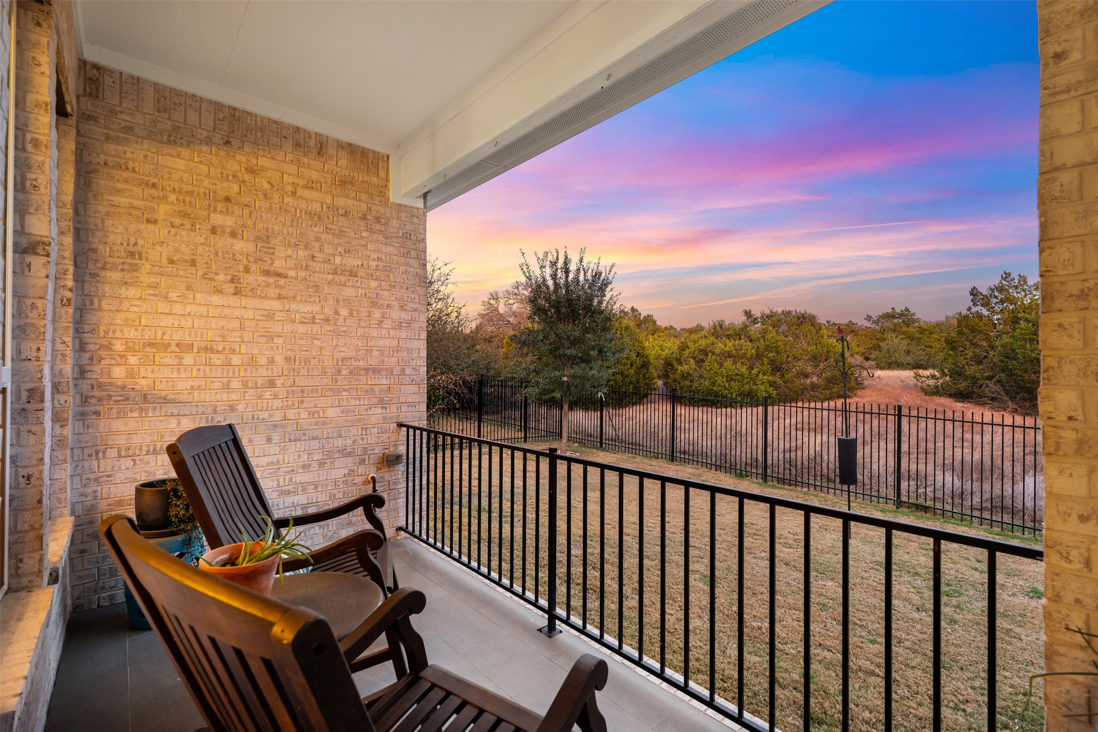 438 Pear Tree Lane Austin, TX 78737 - Photo 37 of 40 View of balcony at dusk