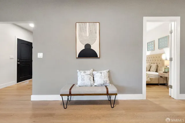 a living room with furniture and a lamp