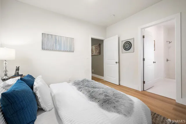 a bedroom with a bed and a cabinets