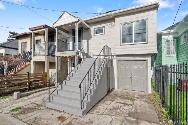 front view of a house with a small yard