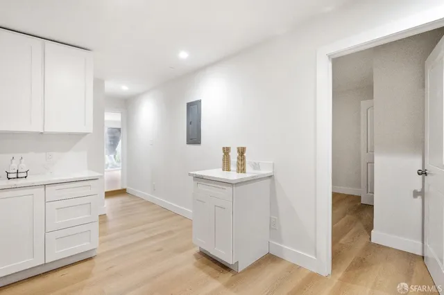 a view of a kitchen cabinets and wooden floor