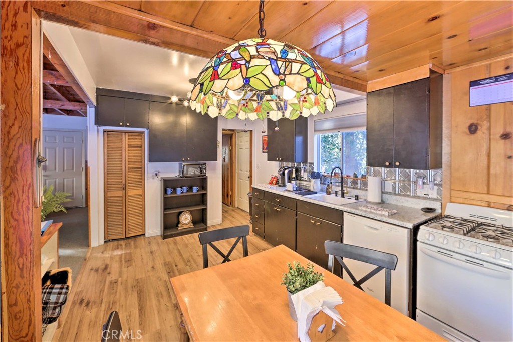 1069 Eagle Road Wrightwood, CA 92397 - Photo 11 of 24 a large kitchen with a table and chairs in it