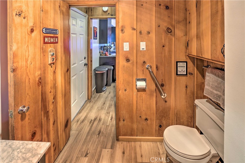 1069 Eagle Road Wrightwood, CA 92397 - Photo 13 of 24 a bathroom with a granite countertop shower curtain and a sink