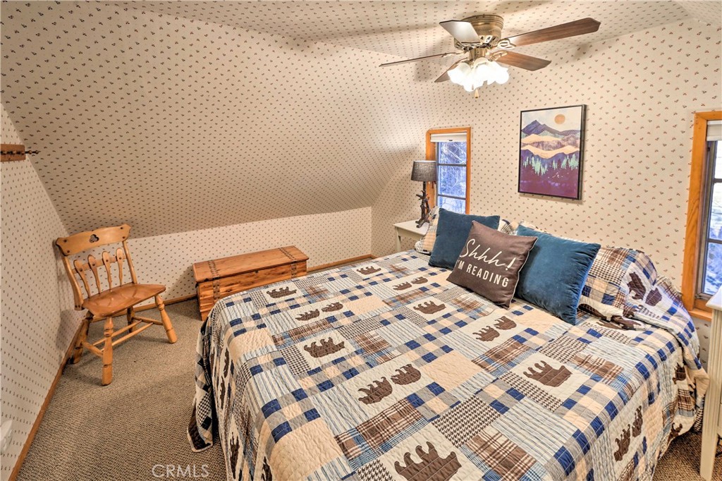 1069 Eagle Road Wrightwood, CA 92397 - Photo 15 of 24 a bedroom with a bed and painting on the wall