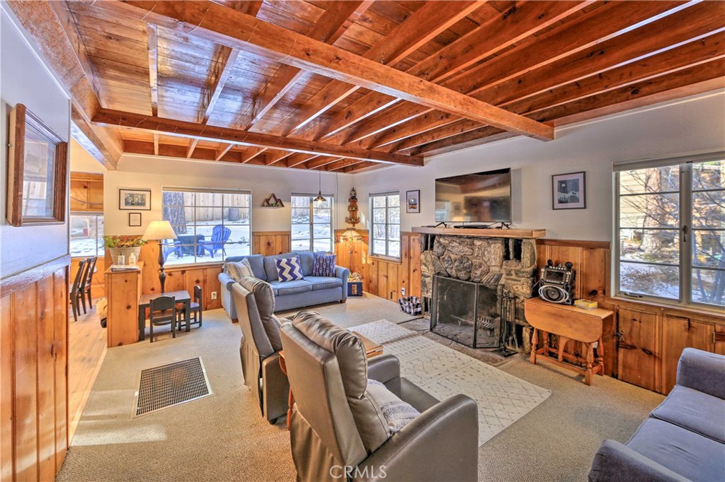 1069 Eagle Road Wrightwood, CA 92397 - Photo 4 of 24 a living room with furniture and a fireplace