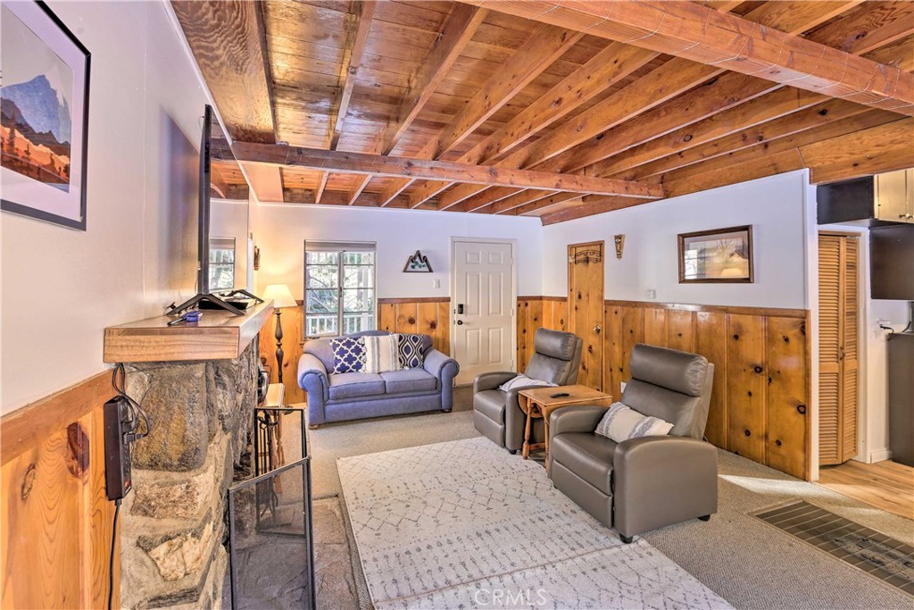 1069 Eagle Road Wrightwood, CA 92397 - Photo 6 of 24 a living room with furniture and a large window