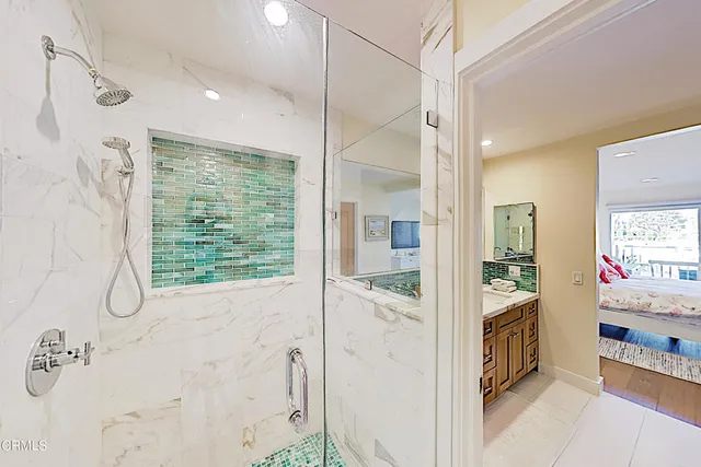 a view of a bathroom with a tub and shower