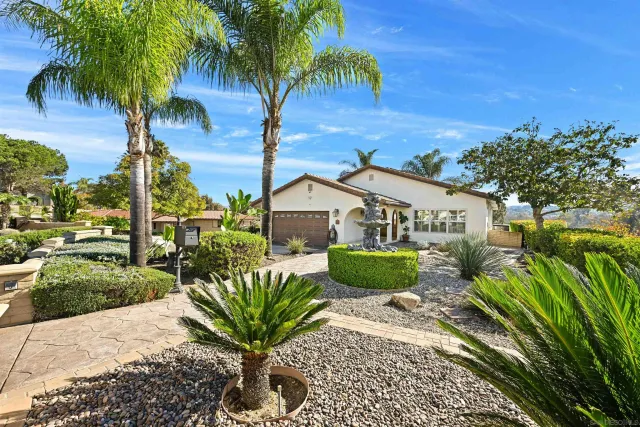 a view of a house with a garden