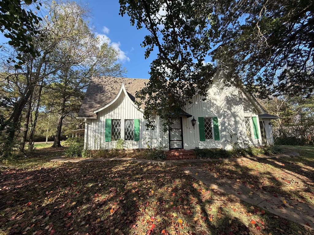 100 Smith Street Naples, TX 75568 - Photo 1 of 30 a view of a house with a yard