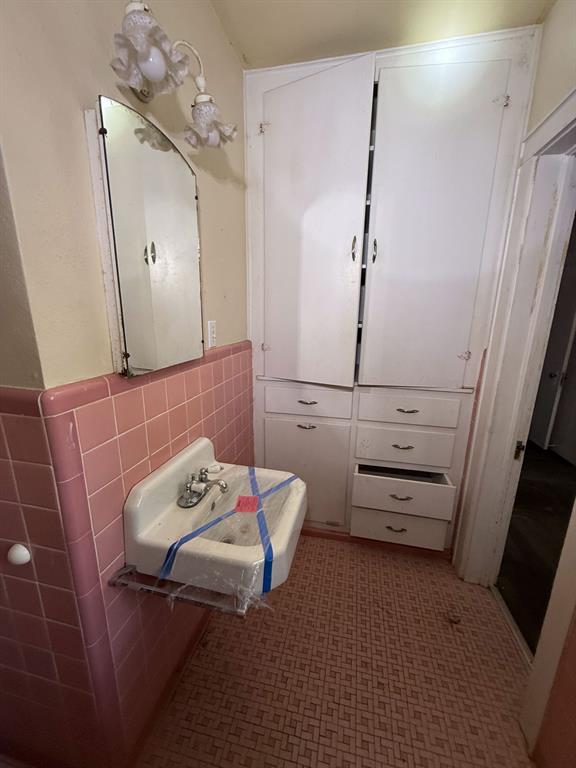 100 Smith Street Naples, TX 75568 - Photo 20 of 30 a bedroom with a bed and a mirror