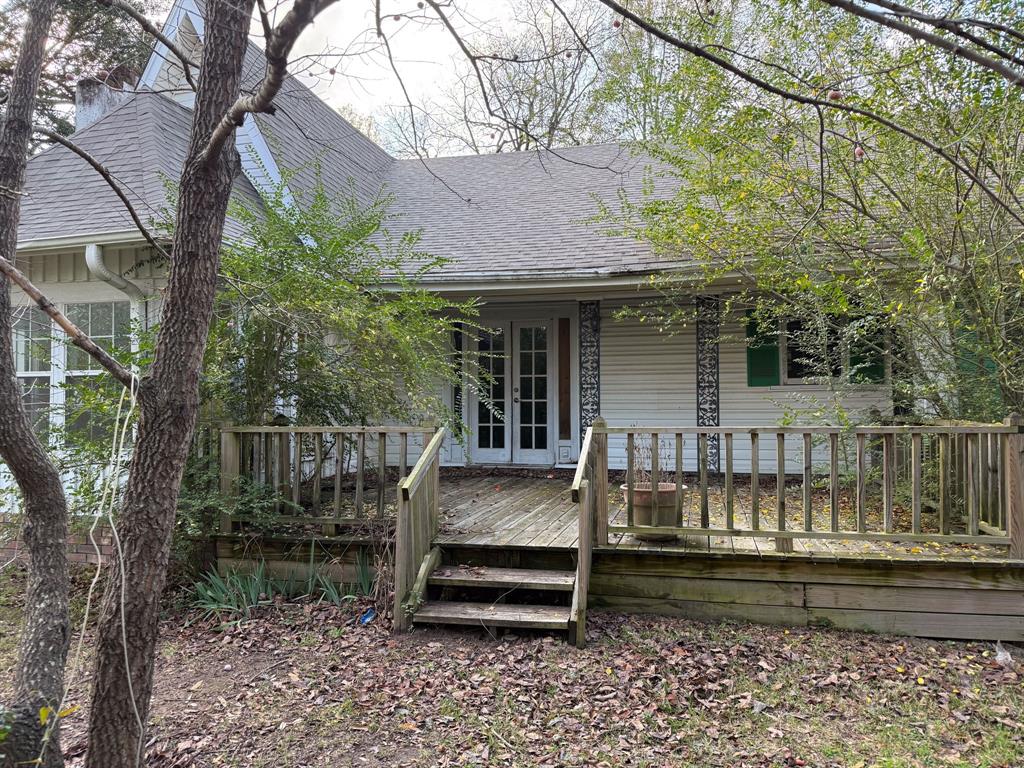 100 Smith Street Naples, TX 75568 - Photo 24 of 30 a front view of a house with a balcony