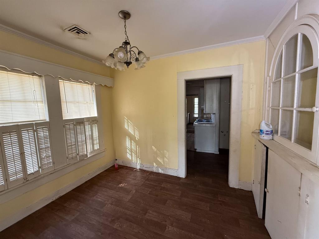 100 Smith Street Naples, TX 75568 - Photo 7 of 30 wooden floor in an empty room with a window