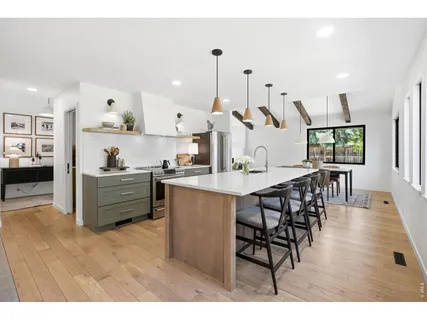 a view of kitchen with cabinets and wooden floor