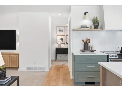 a kitchen with cabinets and window