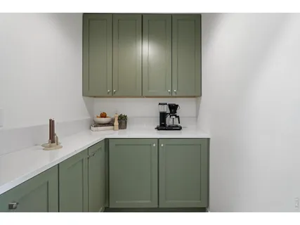 a kitchen with a sink cabinets and a granite counter tops