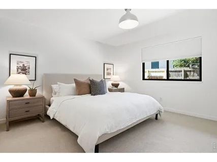 a bedroom with bed and window