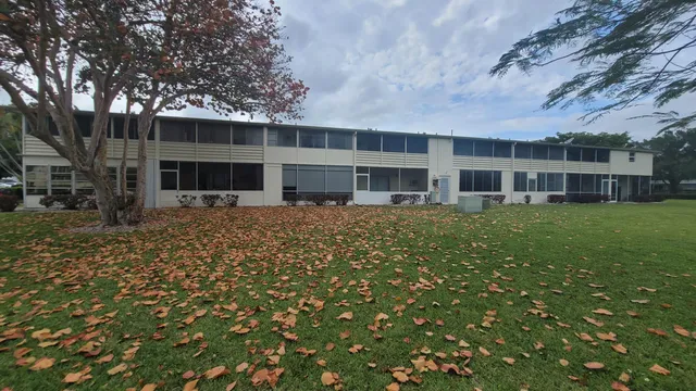 front view of a building with a yard