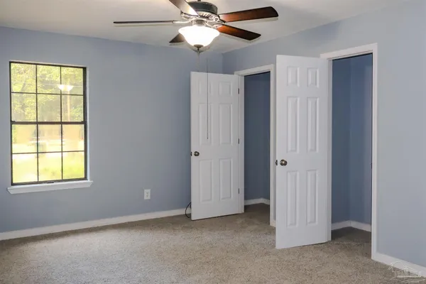 a view of an empty room with a window