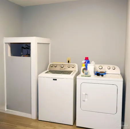 a utility room with dryer and washer