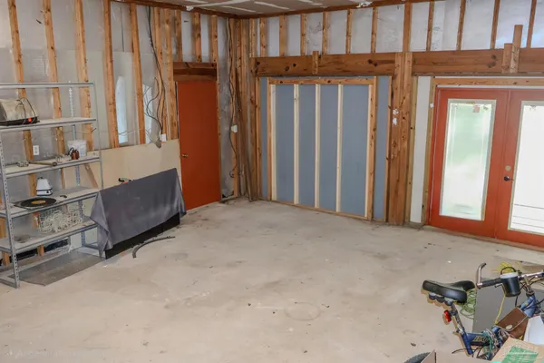 a view of a room with furniture and window