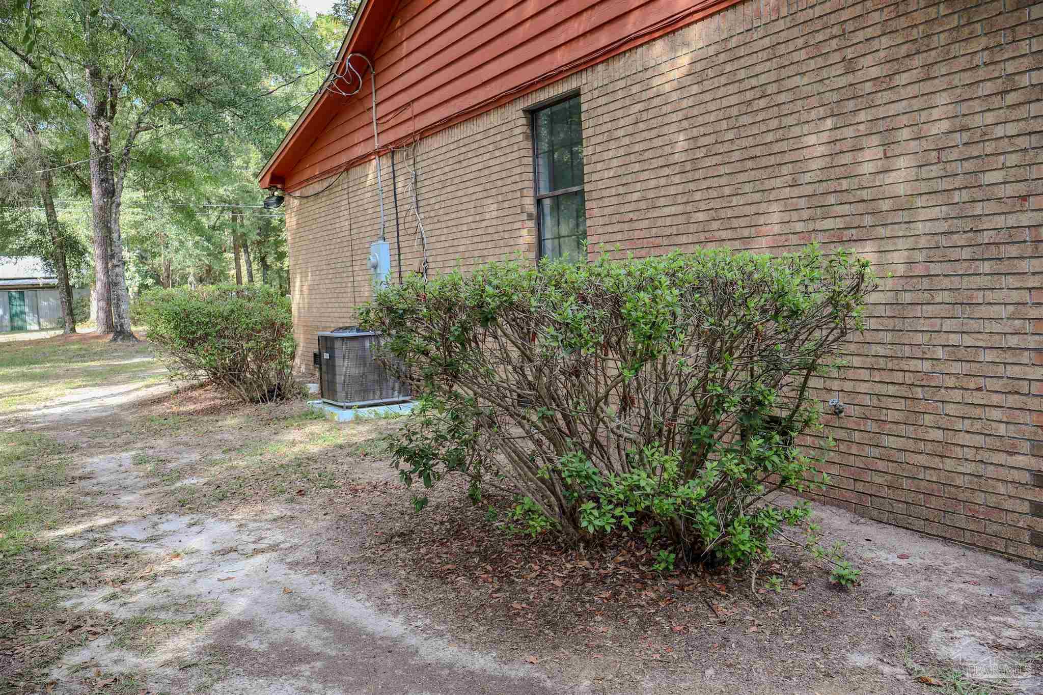 111 Cotton Creek Road McDavid, FL 32568 - Photo 28 of 30 a view of a backyard with plants