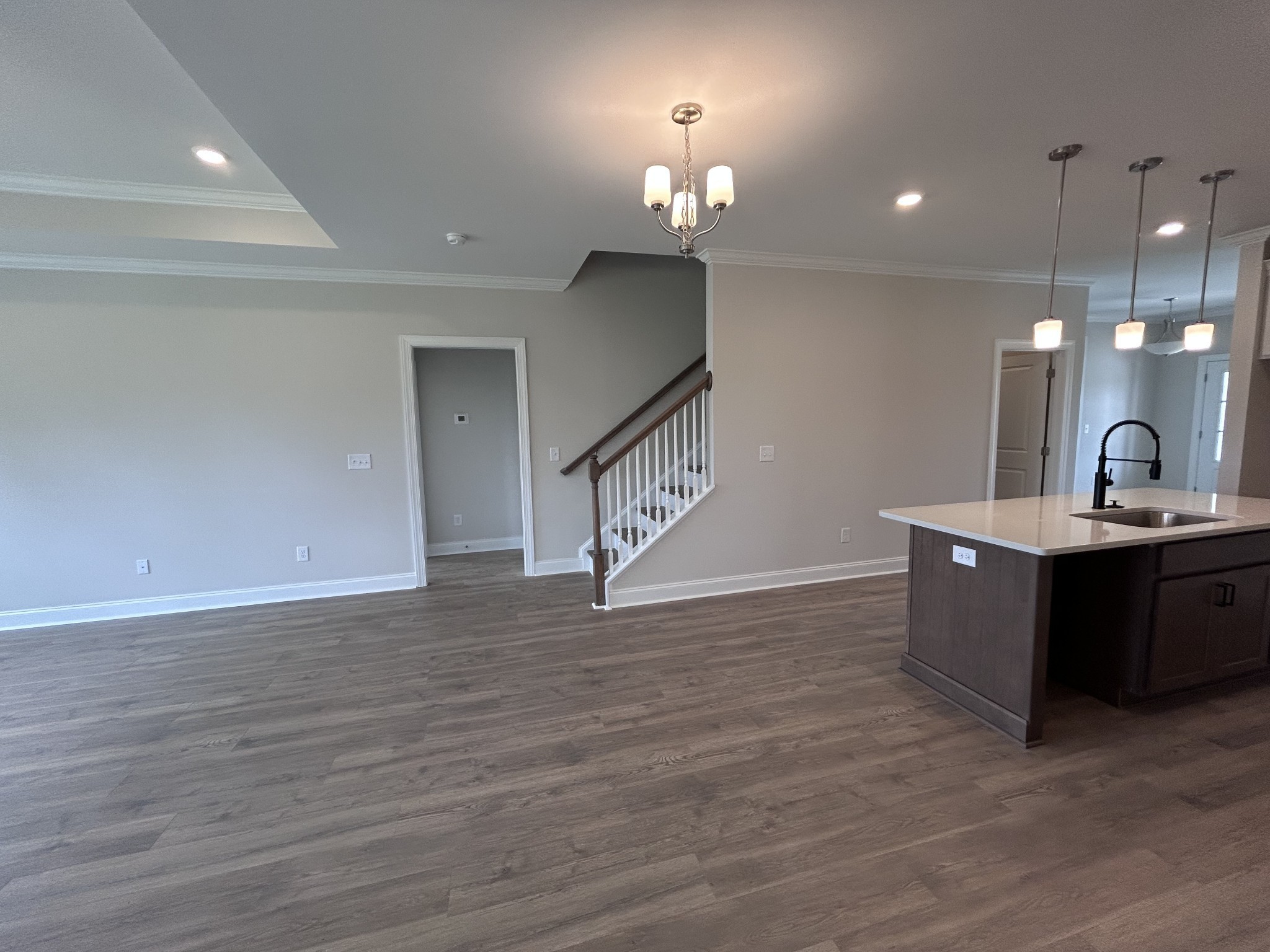 6502 Ripple Ridge Columbia, TN 38401 - Photo 17 of 52 a large room with a chandelier fan and wooden floor