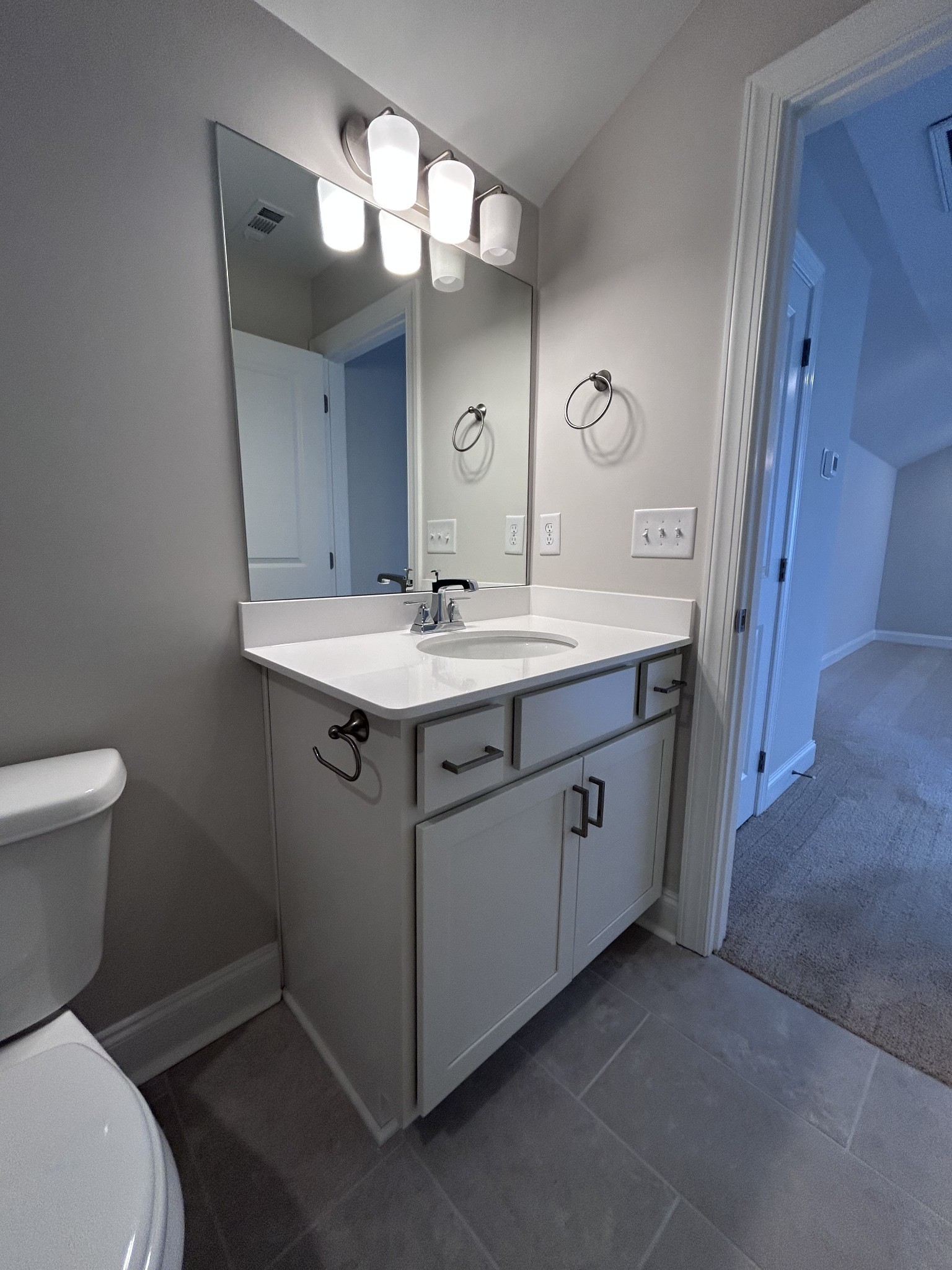 6502 Ripple Ridge Columbia, TN 38401 - Photo 47 of 52 a spacious bathroom with a toilet sink and mirror
