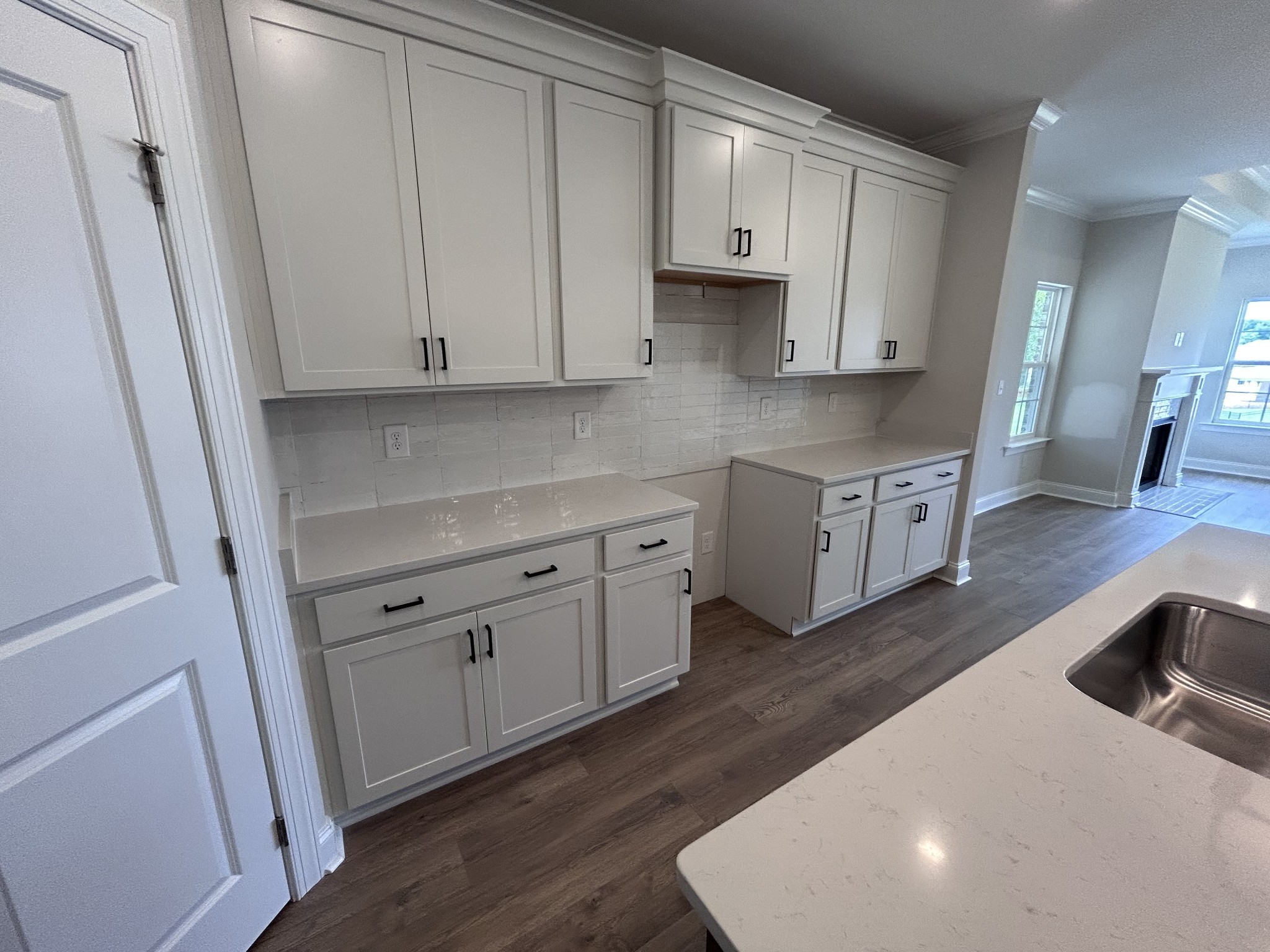 6502 Ripple Ridge Columbia, TN 38401 - Photo 7 of 52 a kitchen with stainless steel appliances a white cabinets sink and wooden floor