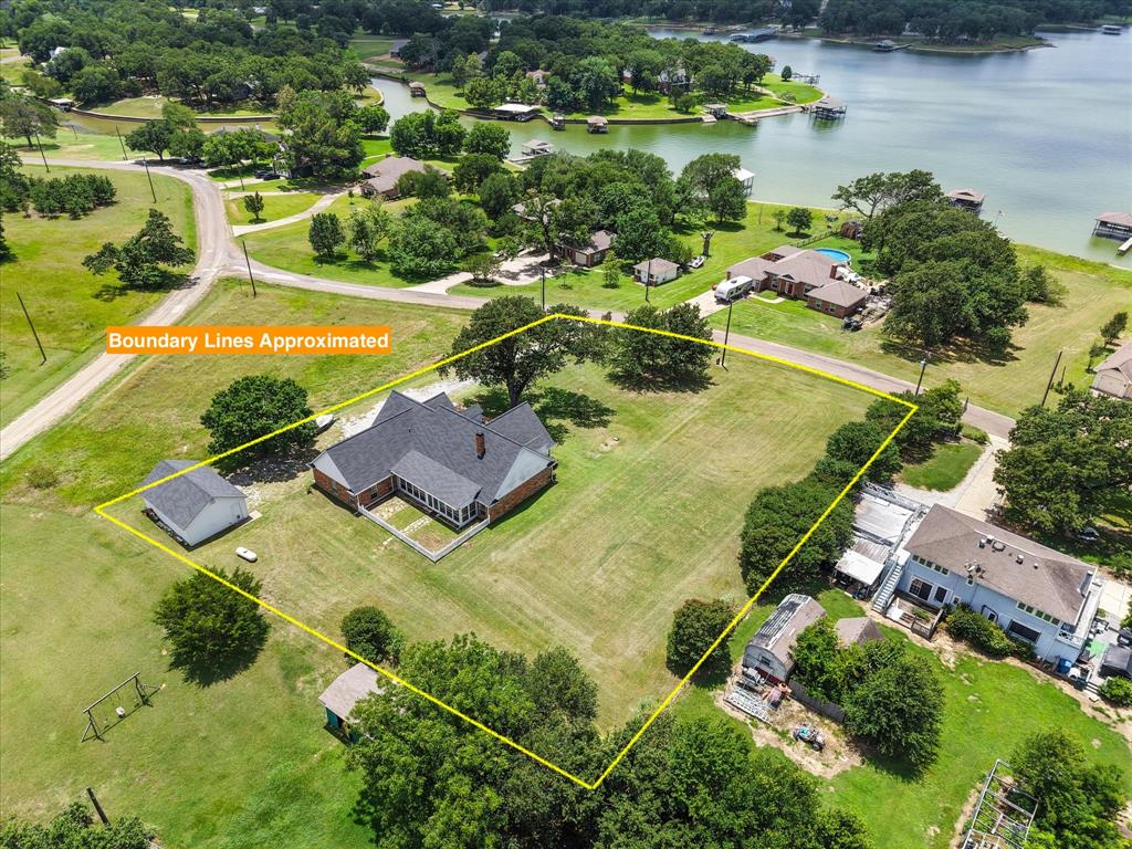 13021 Rudy's Way Streetman, TX 75859 - Photo 34 of 40 Aerial view near Corsicana showcasing nearby homes, open green space, and the lake-area neighborhood setting.
