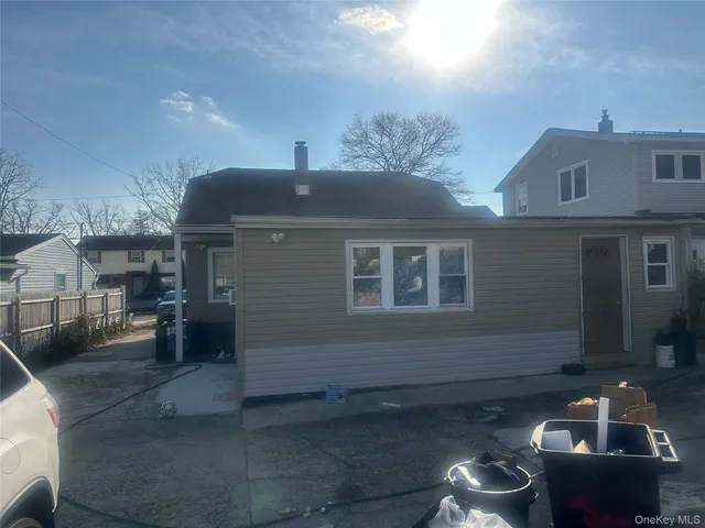 a front view of a house with parking space