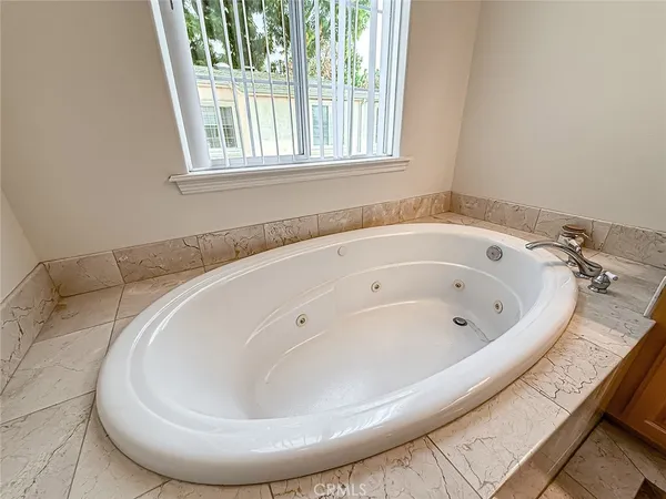 a bathroom with a shower and a glass door