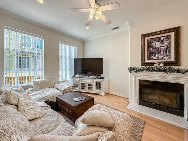 a view of a a dining room with furniture window and wooden floor