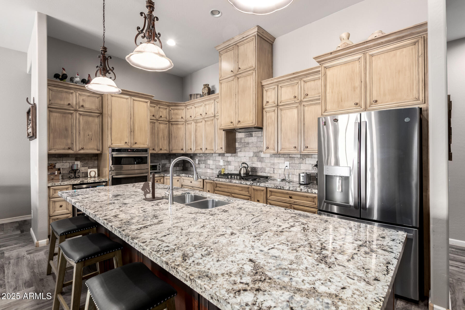 17024 East Lone Mountain Road Rio Verde, AZ 85263 - Photo 15 of 42 a kitchen with stainless steel appliances granite countertop a sink refrigerator and cabinets