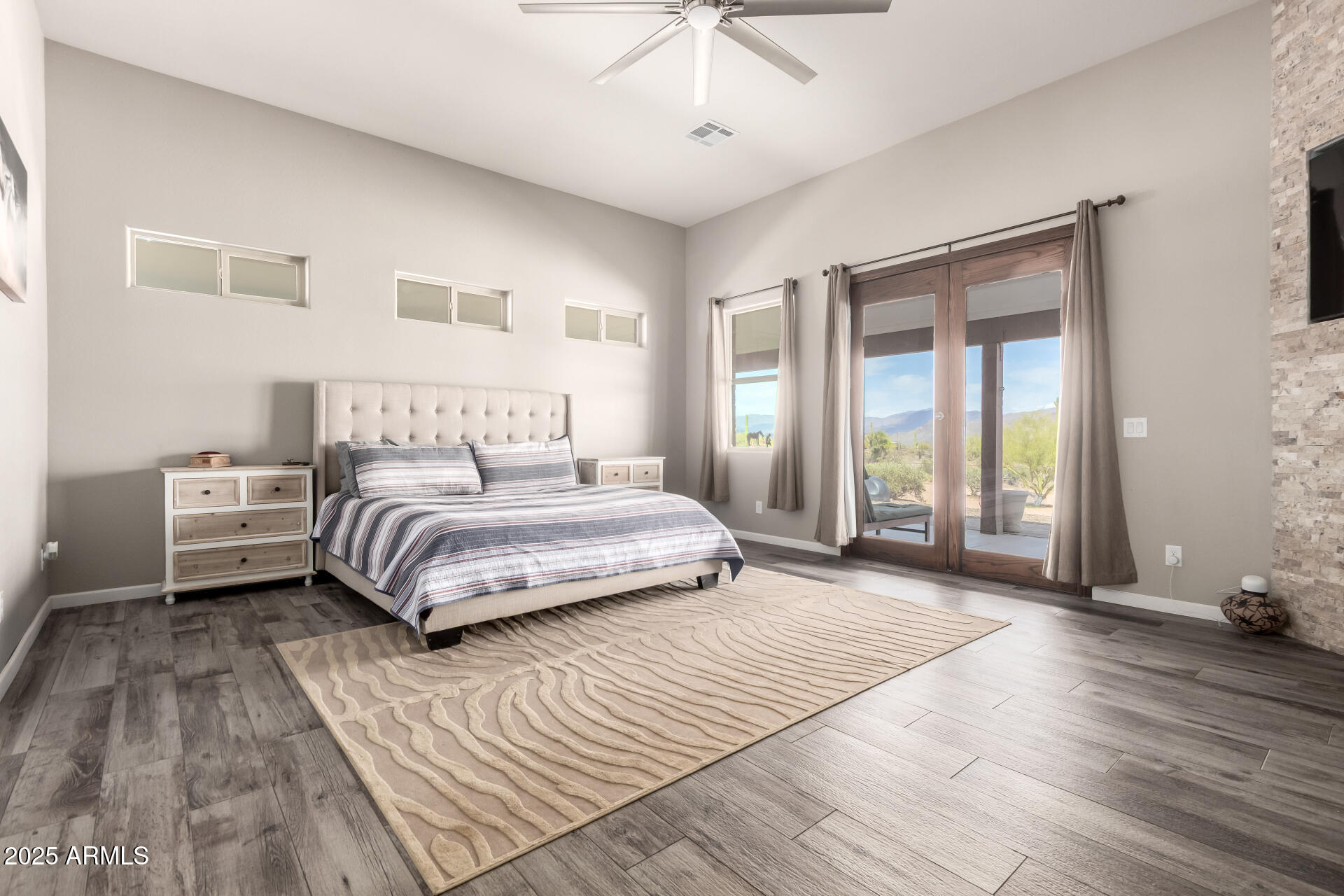 17024 East Lone Mountain Road Rio Verde, AZ 85263 - Photo 18 of 42 a bedroom with a large bed and a window