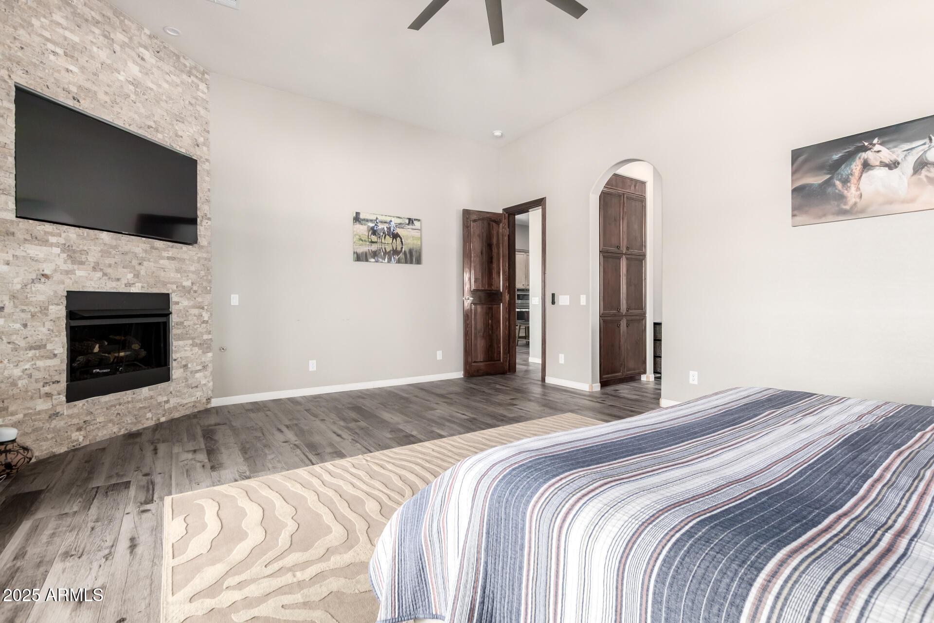 17024 East Lone Mountain Road Rio Verde, AZ 85263 - Photo 20 of 42 a bedroom with a bed and a flat screen tv