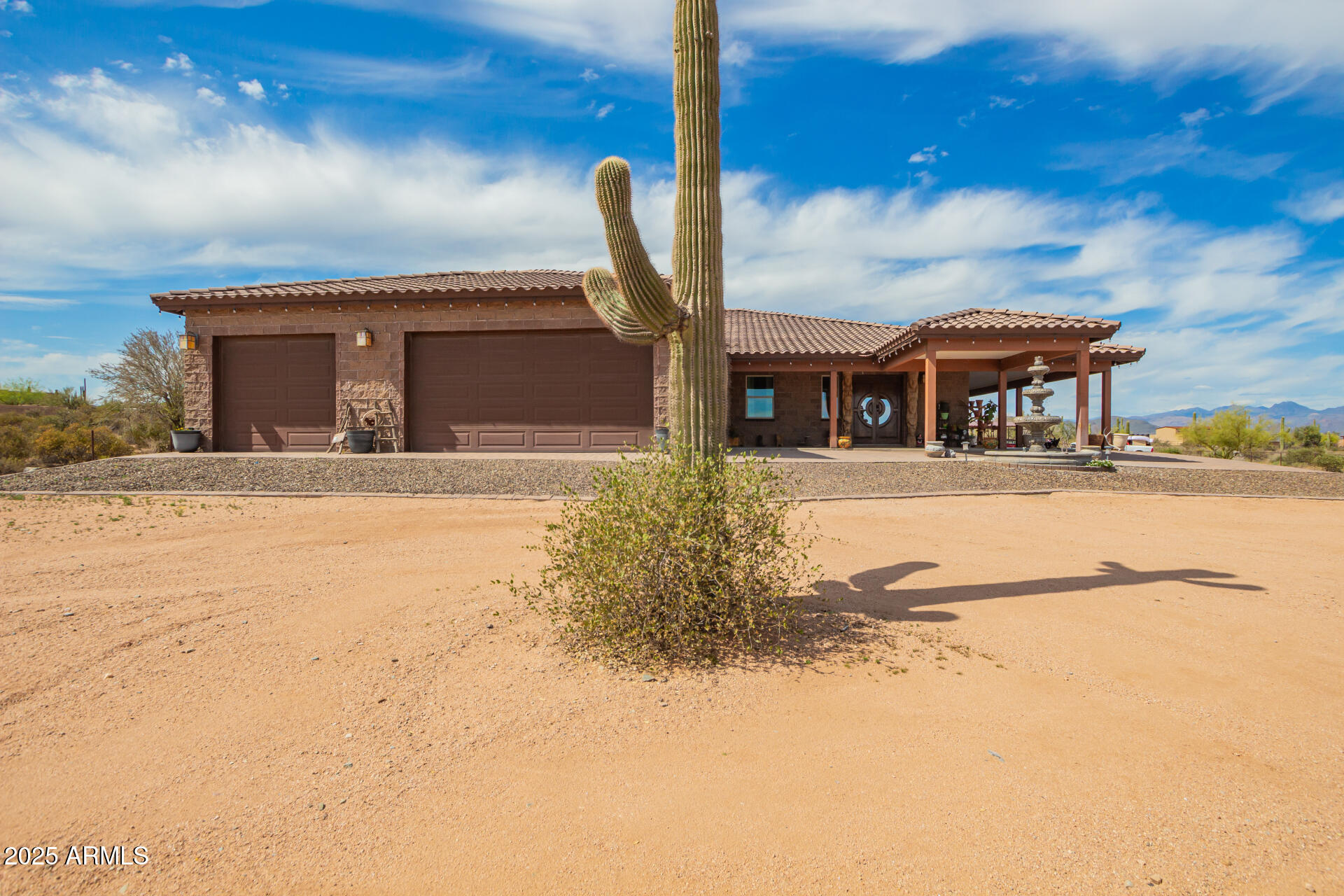 17024 East Lone Mountain Road Rio Verde, AZ 85263 - Photo 2 of 42 a front view of a house with a yard