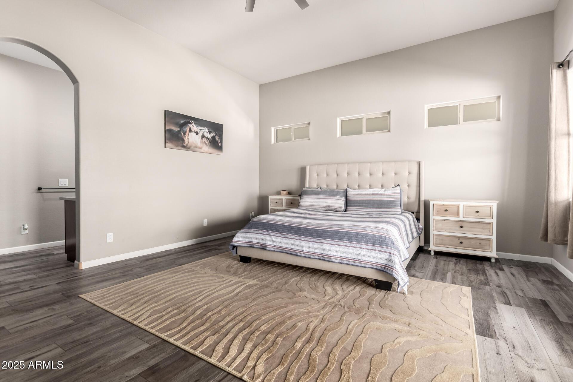 17024 East Lone Mountain Road Rio Verde, AZ 85263 - Photo 23 of 42 a bedroom with a bed and a view of kitchen