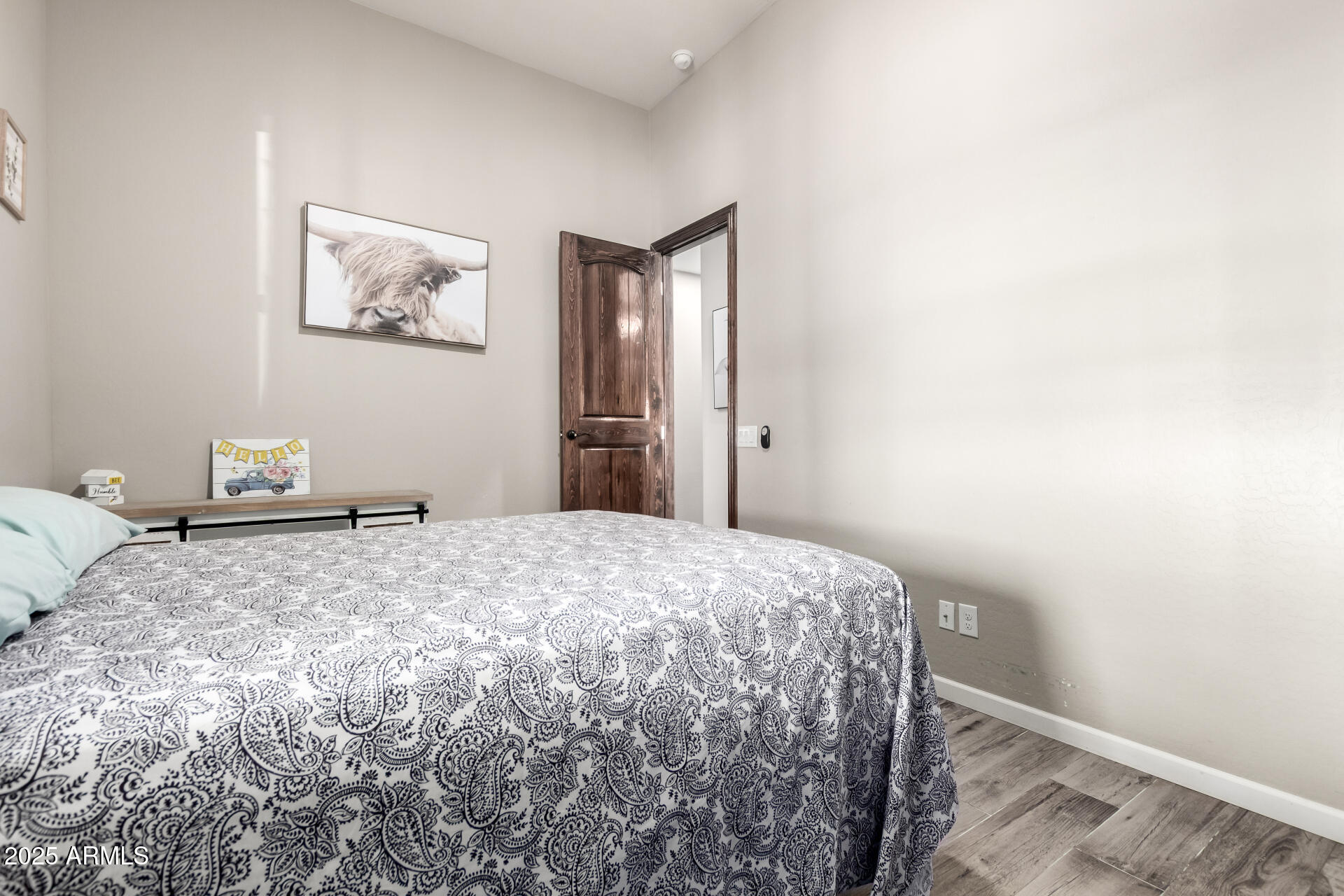 17024 East Lone Mountain Road Rio Verde, AZ 85263 - Photo 28 of 42 a bedroom with a bed and painting on the wall