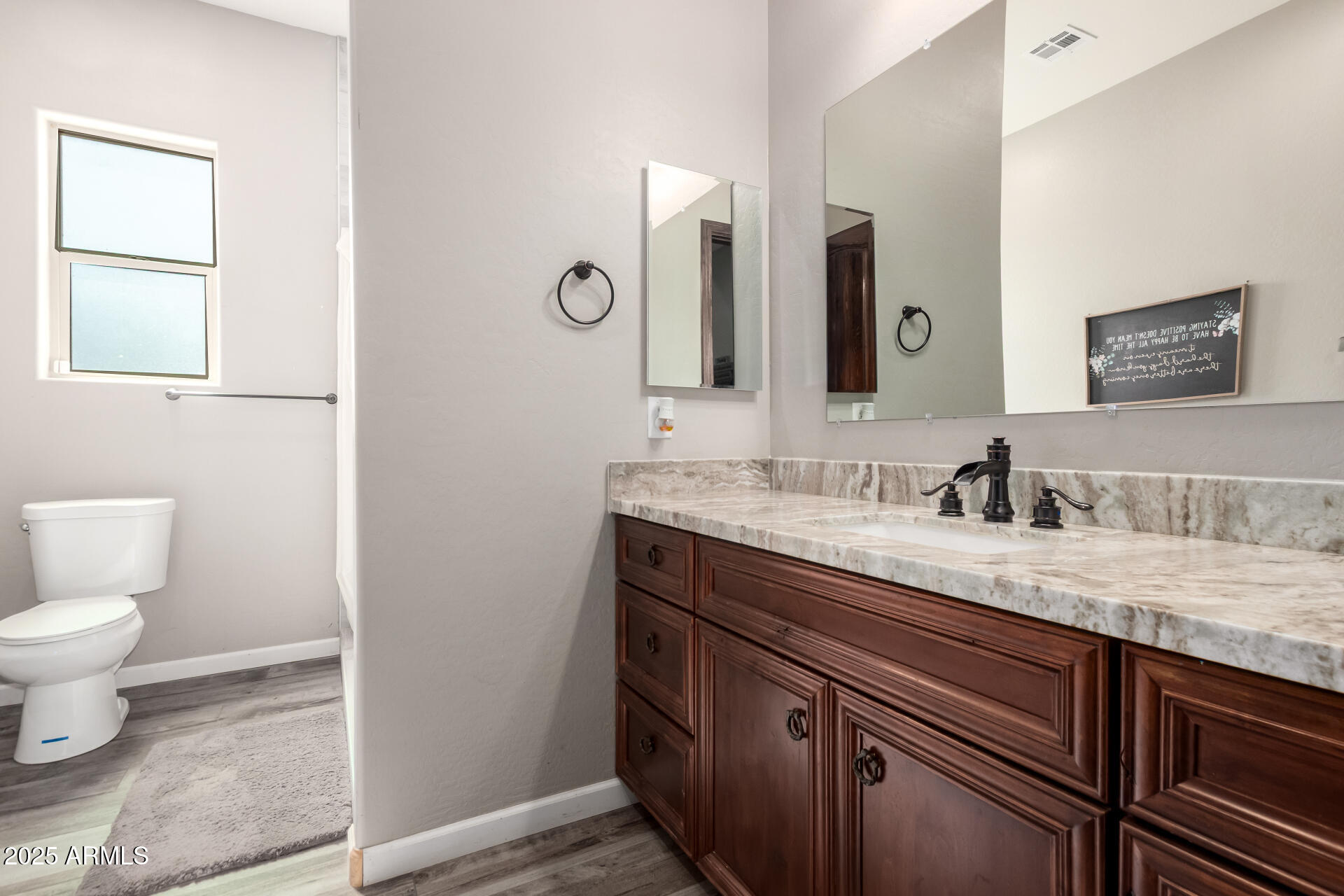 17024 East Lone Mountain Road Rio Verde, AZ 85263 - Photo 29 of 42 a bathroom with a granite countertop toilet sink and mirror