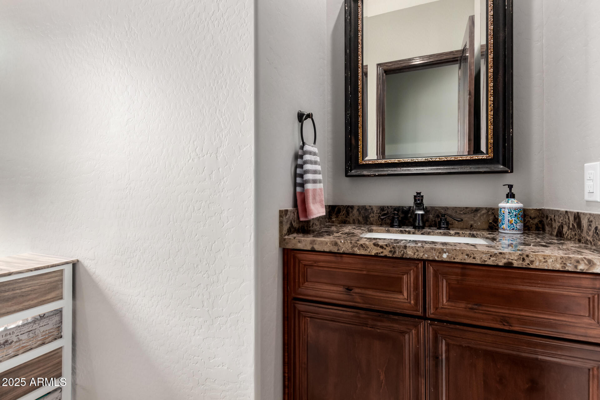17024 East Lone Mountain Road Rio Verde, AZ 85263 - Photo 32 of 42 a bathroom with a granite countertop sink and a mirror