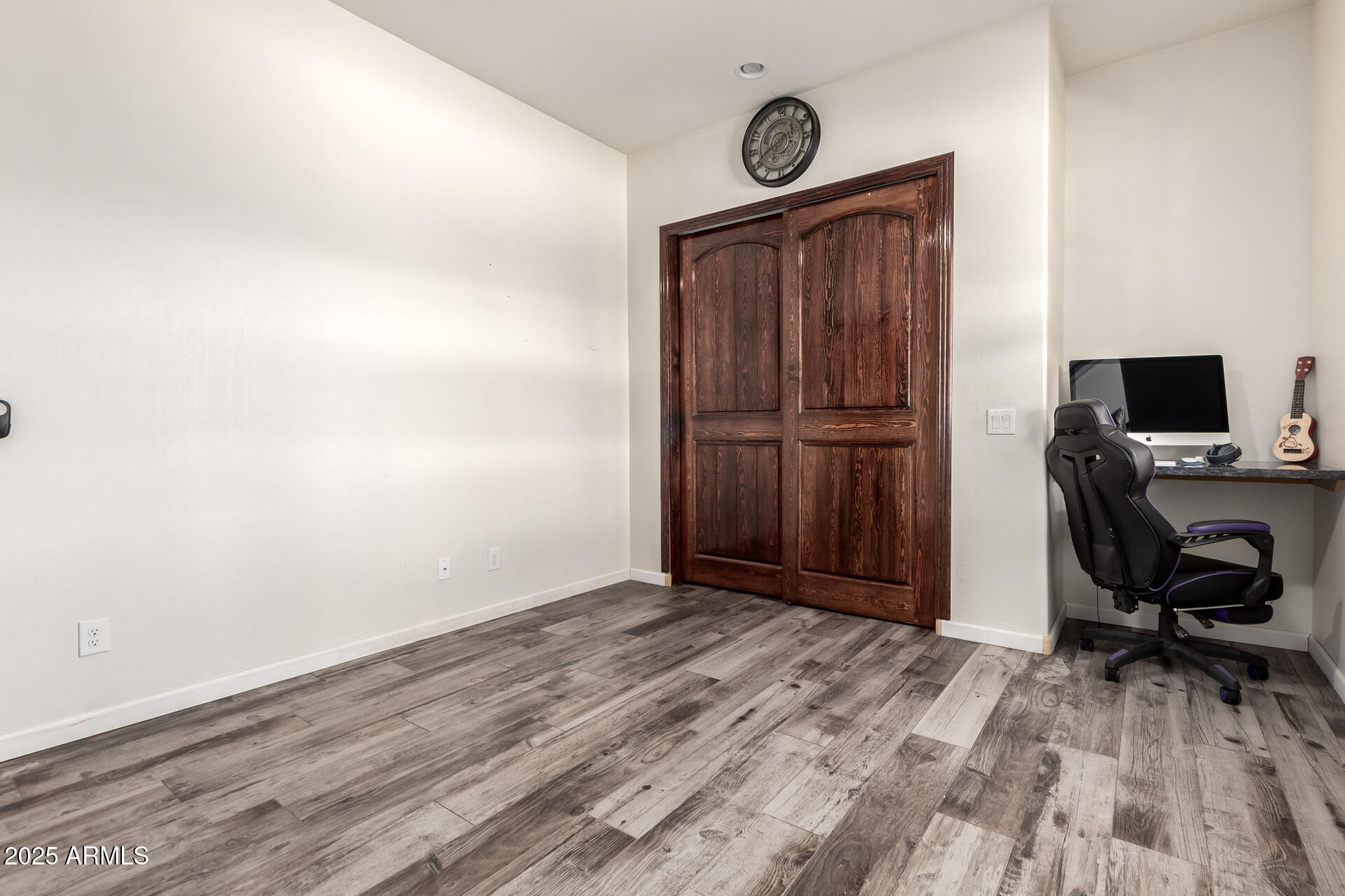 17024 East Lone Mountain Road Rio Verde, AZ 85263 - Photo 35 of 42 a view of a workspace with furniture and wooden floor