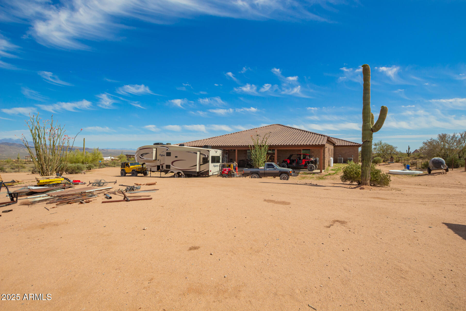 17024 East Lone Mountain Road Rio Verde, AZ 85263 - Photo 36 of 42 a front view of a house with a yard