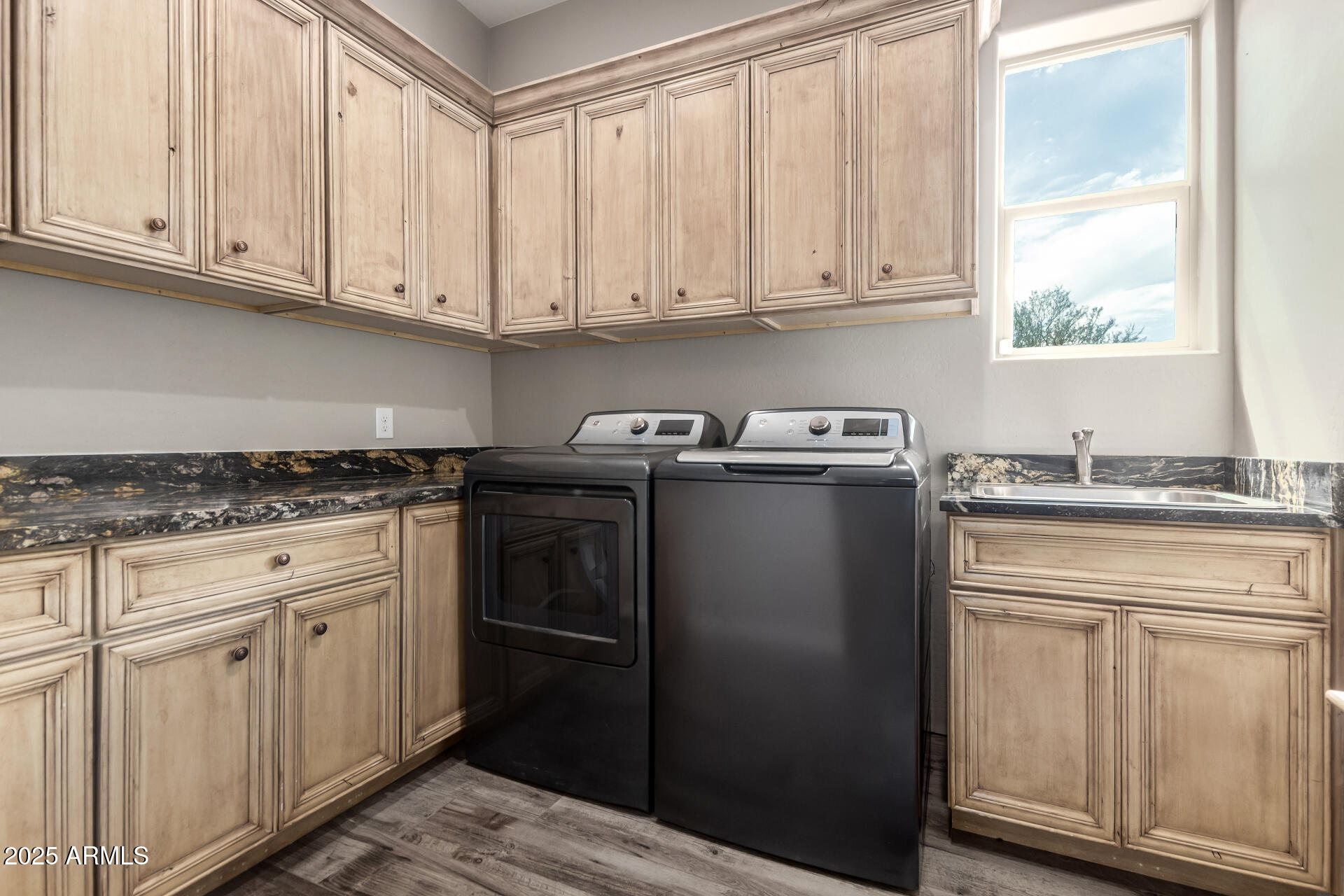 17024 East Lone Mountain Road Rio Verde, AZ 85263 - Photo 37 of 42 a kitchen with stainless steel appliances granite countertop a refrigerator sink and cabinets