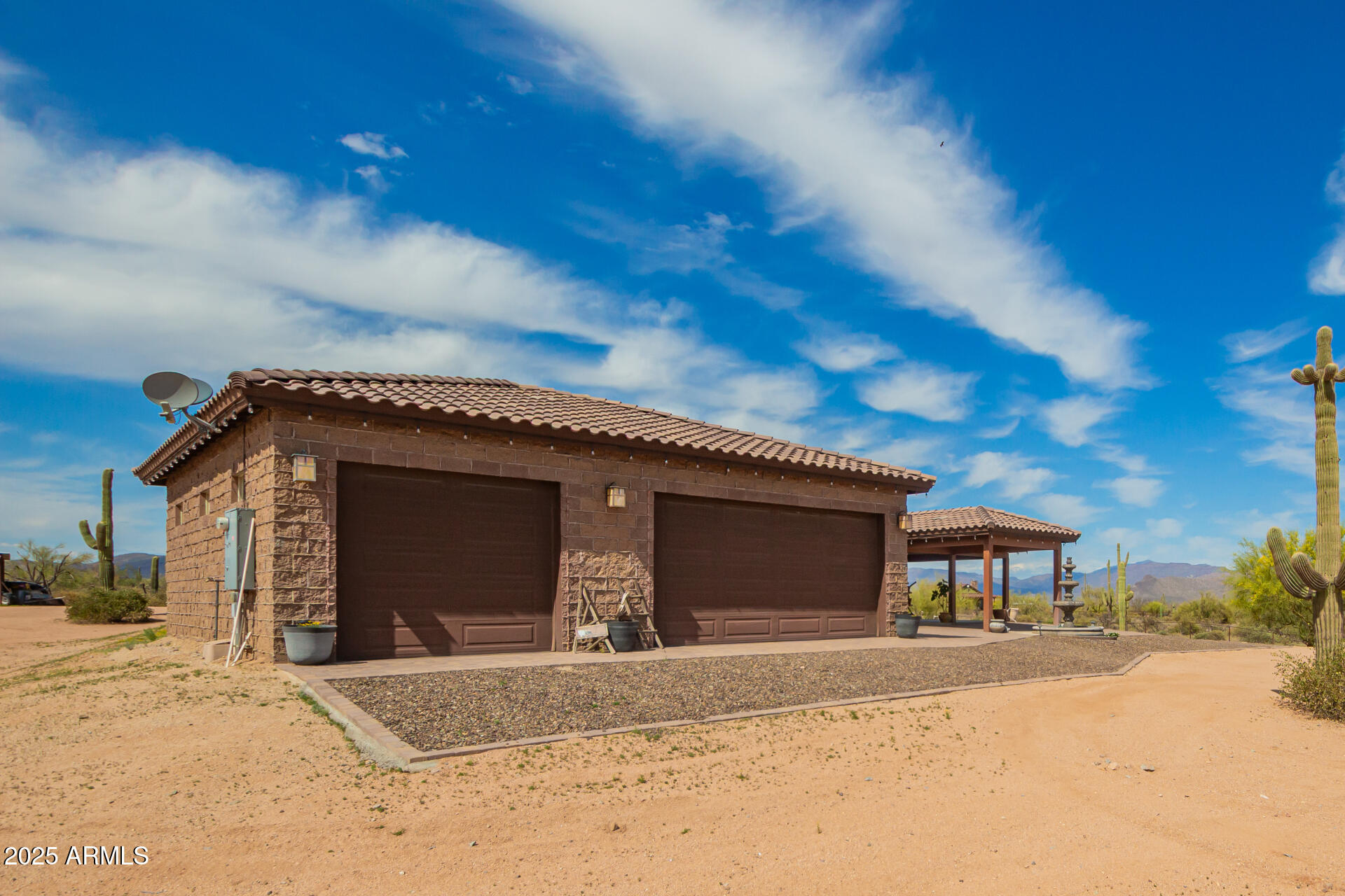 17024 East Lone Mountain Road Rio Verde, AZ 85263 - Photo 5 of 42 a front view of a house with a yard