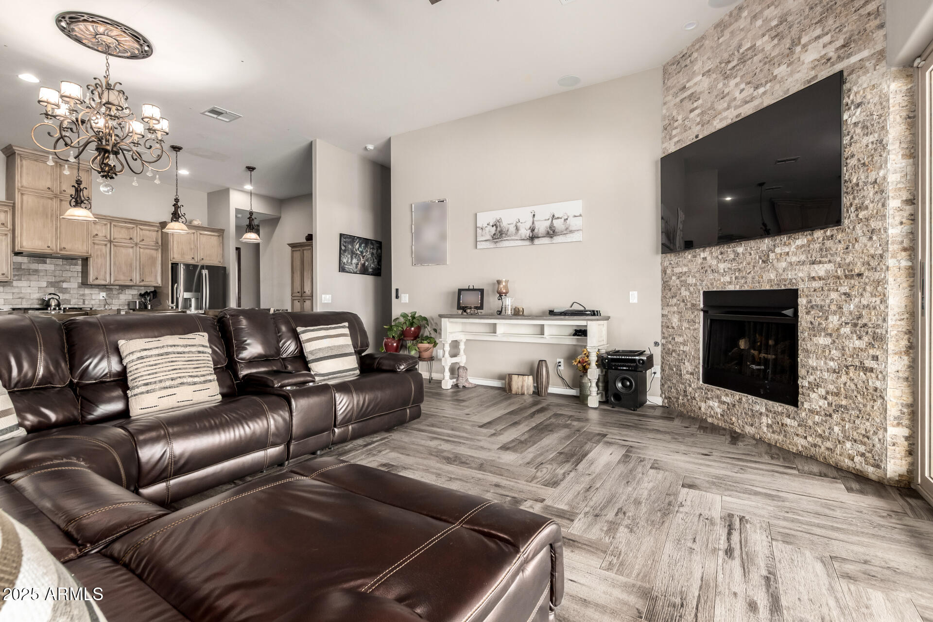 17024 East Lone Mountain Road Rio Verde, AZ 85263 - Photo 9 of 42 a living room with furniture a fireplace and a flat screen tv